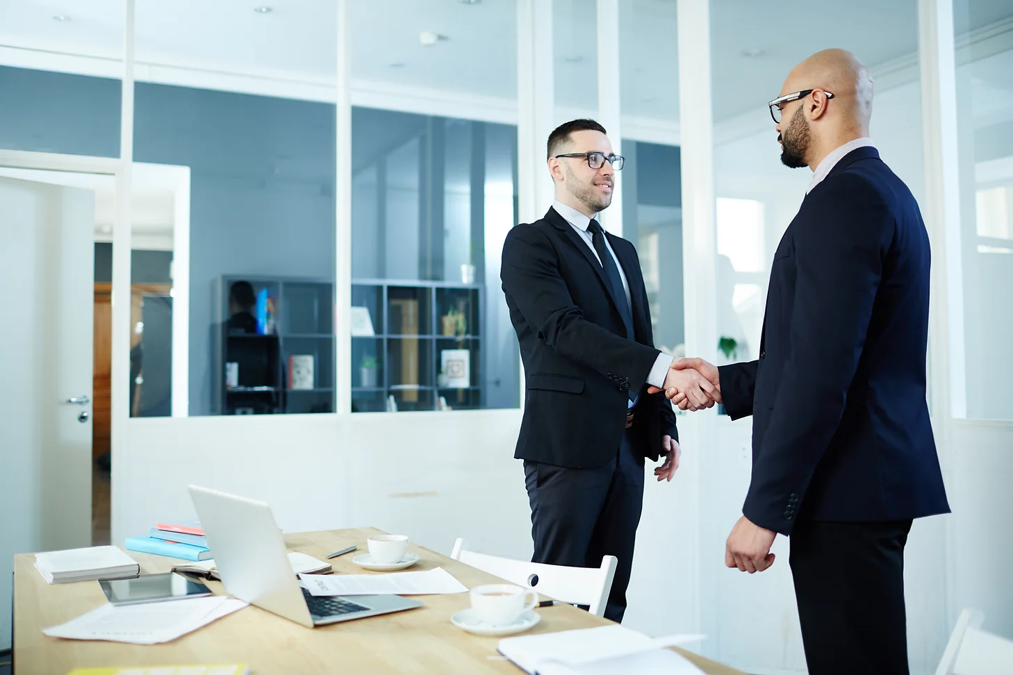 Recruiter shaking hands with a candidate after an interview